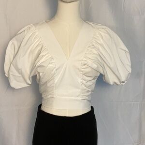 Ambar white cropped top w/exaggerated sleeve. Size S